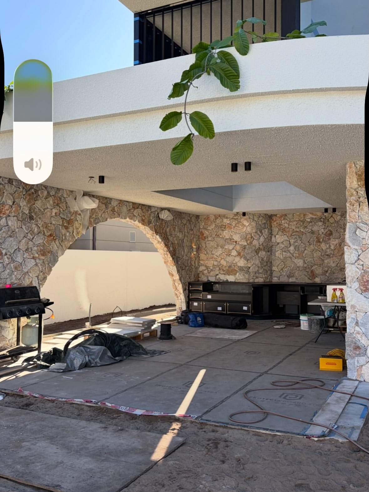 Wide view of a stone archway and entrance under construction