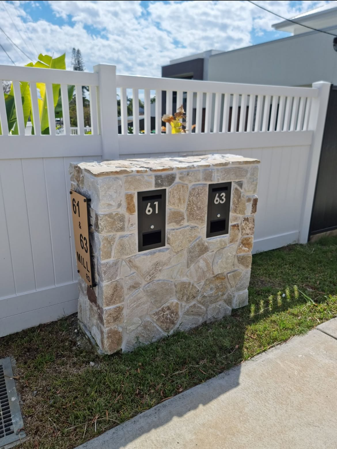 Custom stone letterbox with two mail slots at 61 and 63 Mill Road